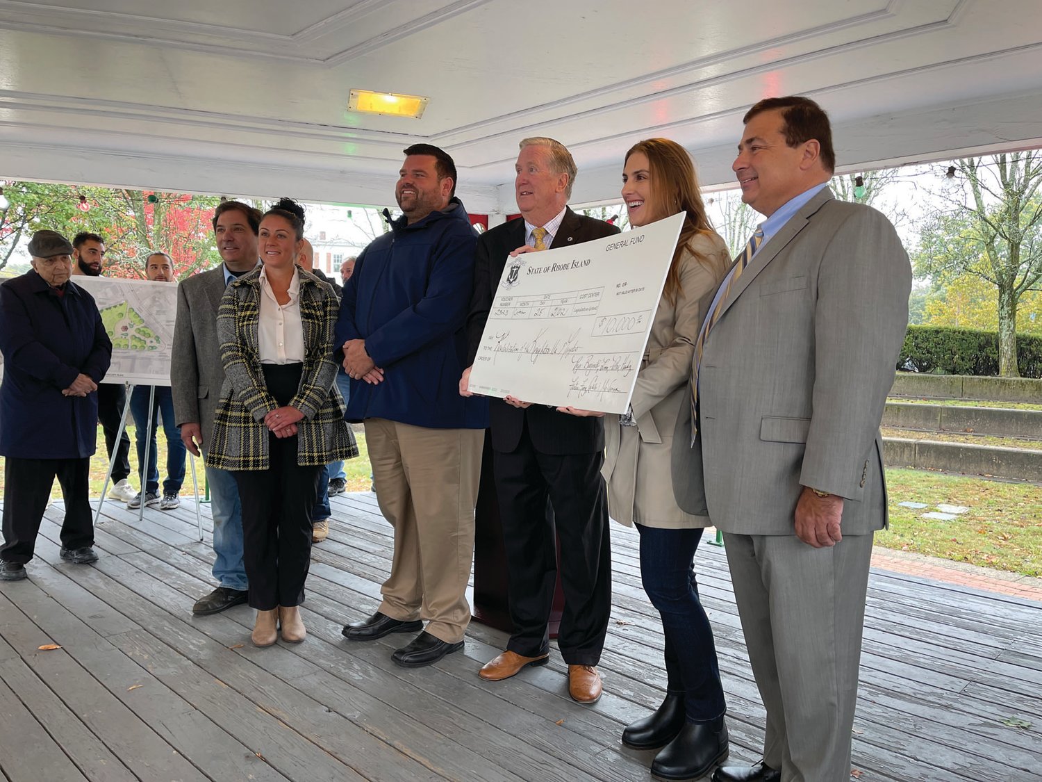 STATE SUPPORT: From left, Ward 4 Councilman Richard Campopiano, Citywide Councilwoman Nicole Renzulli, Council President Chris Paplauskas, Mayor Ken Hopkins, Rep. Jacquelyn Baginski and Speaker K. Joseph Shekarchi gather for the presentation of a $10,000 legislative grant in support of the Knightsville revitalization project.